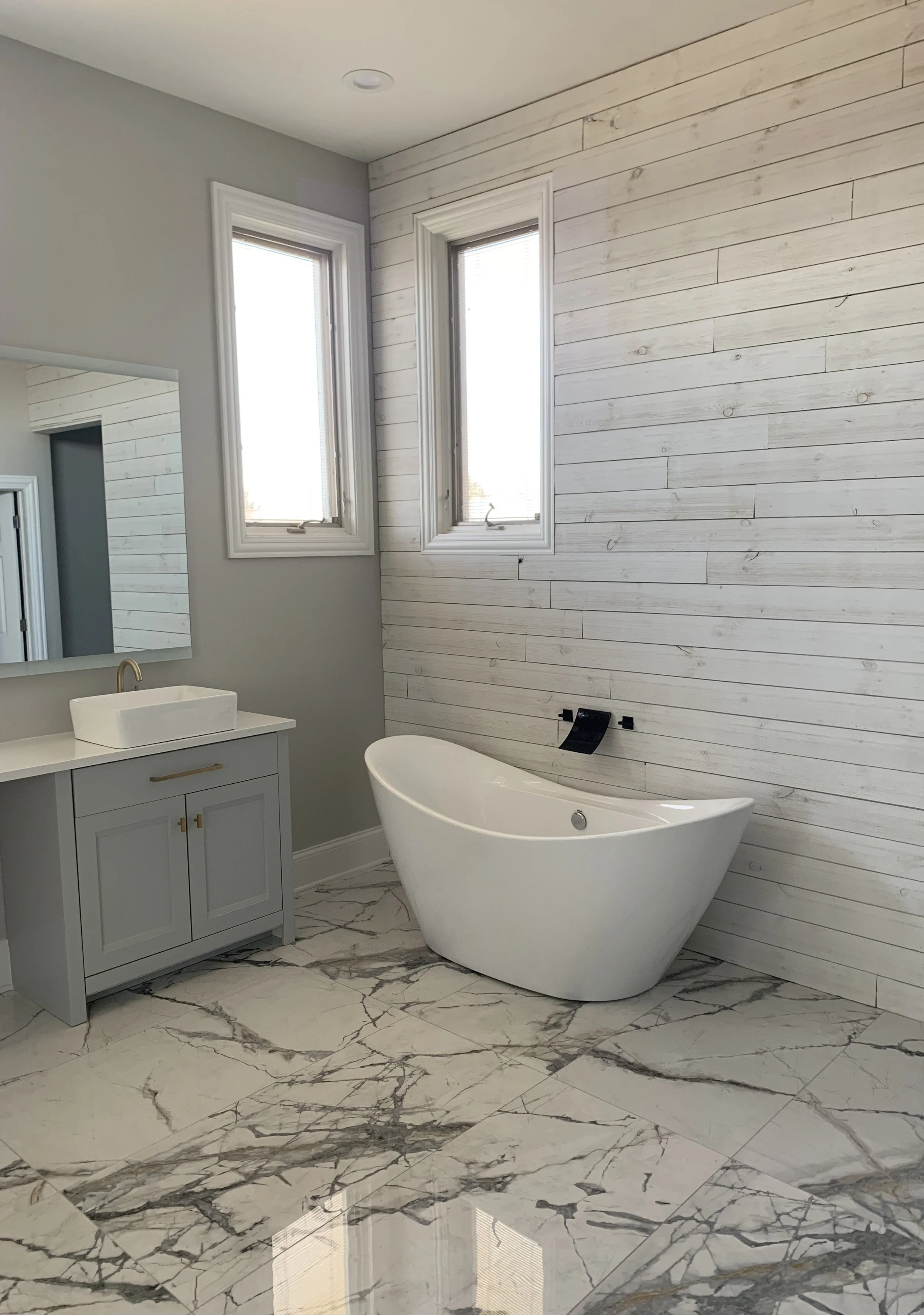 Complete bathroom remodels by Artisan Tile Creations serving Crystal Lake IL and the northwest Chicago suburbs. Featuring freestanding soaking tubs, frameless glass showers, heated tile floors, zero entry showers, custom tile work in marble, porcelai