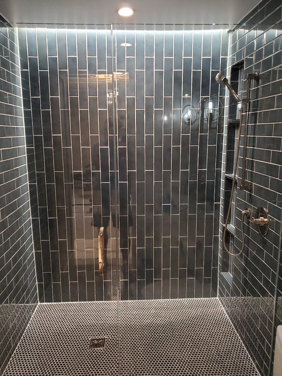 Floor to ceiling dark charcoal vertical subway tile shower black penny mosaic pan in Barrington IL