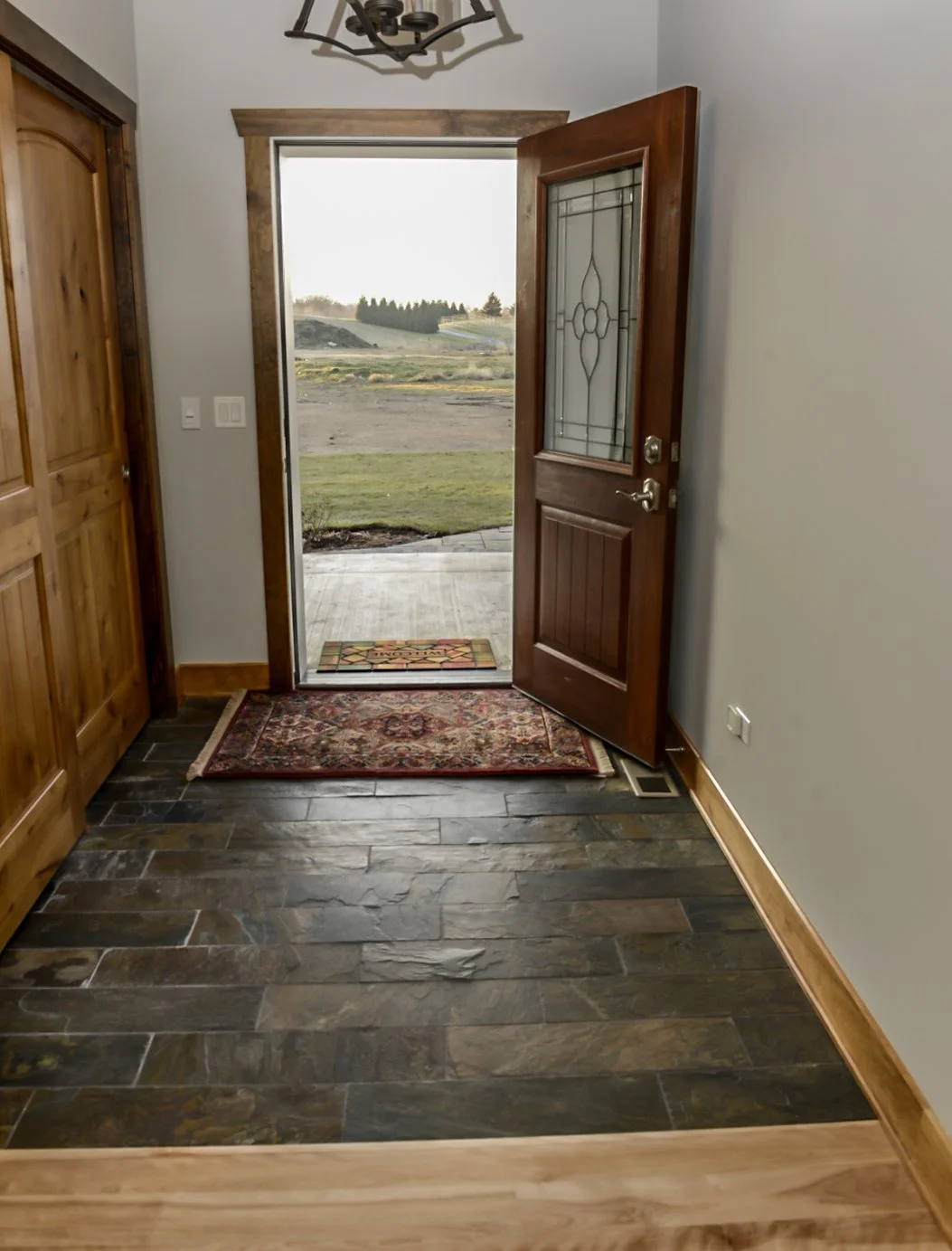 Custom tile and flooring installations by Artisan Tile Creations serving Crystal Lake IL and the northwest Chicago suburbs. Featuring large format porcelain, natural stone, marble, travertine, wood look plank tile, hex mosaic, herringbone, diagonal p