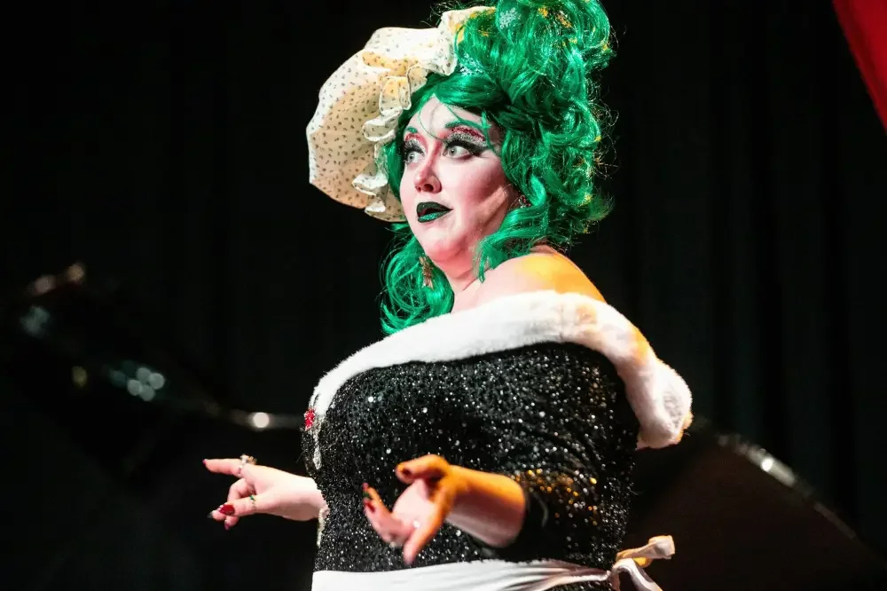 Theresa Thomson (the dame) performs a scene of the Merry Crip-mas Panto at the West End Cultural Centre