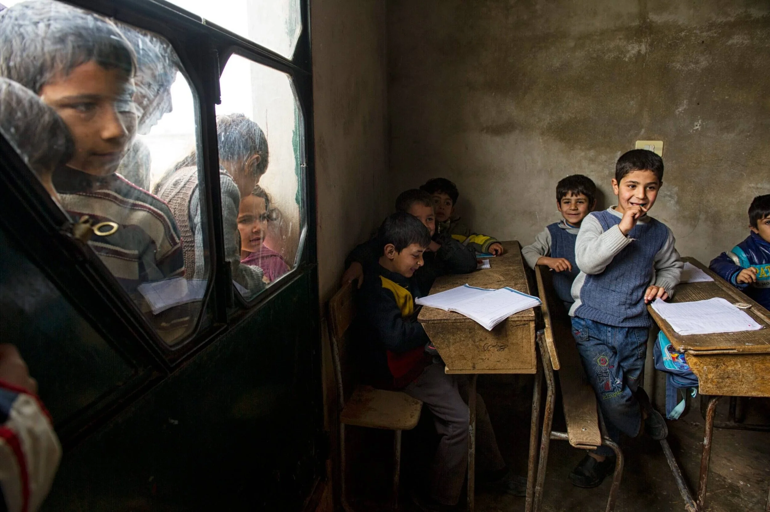  Syrian children go to a small shuttle school, set up for families who were scared to send their children far in the midst of war, in the village of Tlalin, in northern Aleppo province, February 9, 2013. The school is taught by a medical student, who