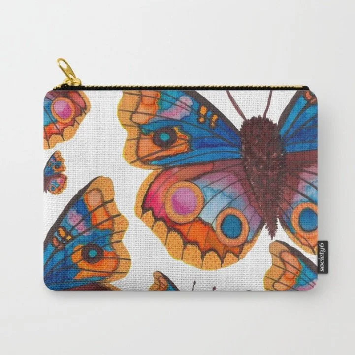 Small pouch with a colorful butterfly print on fabric, featuring large butterflies with orange, blue, pink, and black details, on a white background.