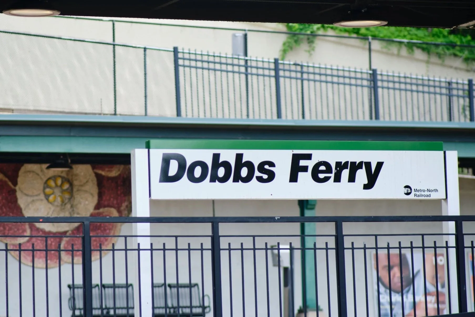 Sign for Dobbs Ferry on the Metro-North Railroad platform.