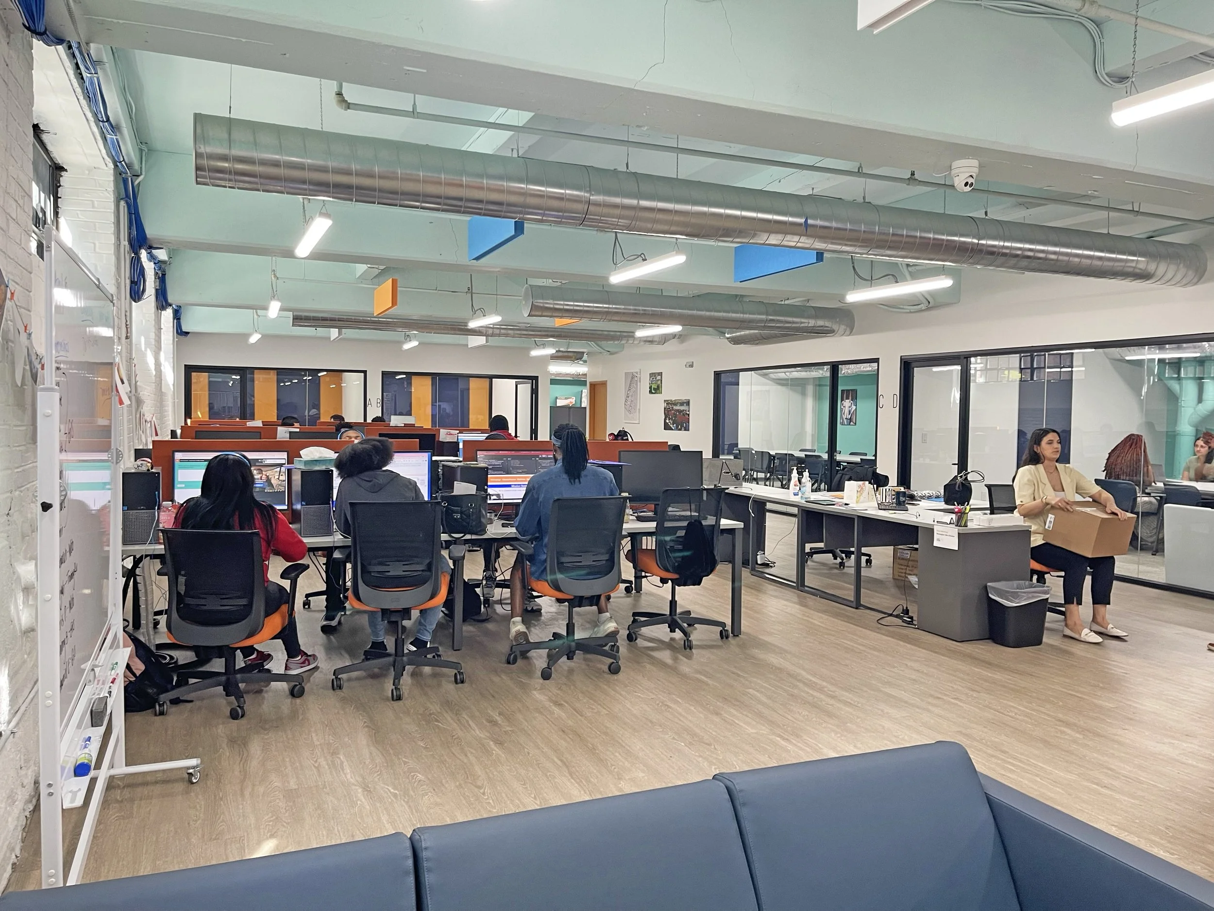 Image of students in session in one of J-centrel's spaces occupied by tech bootcamp, HopeWorks