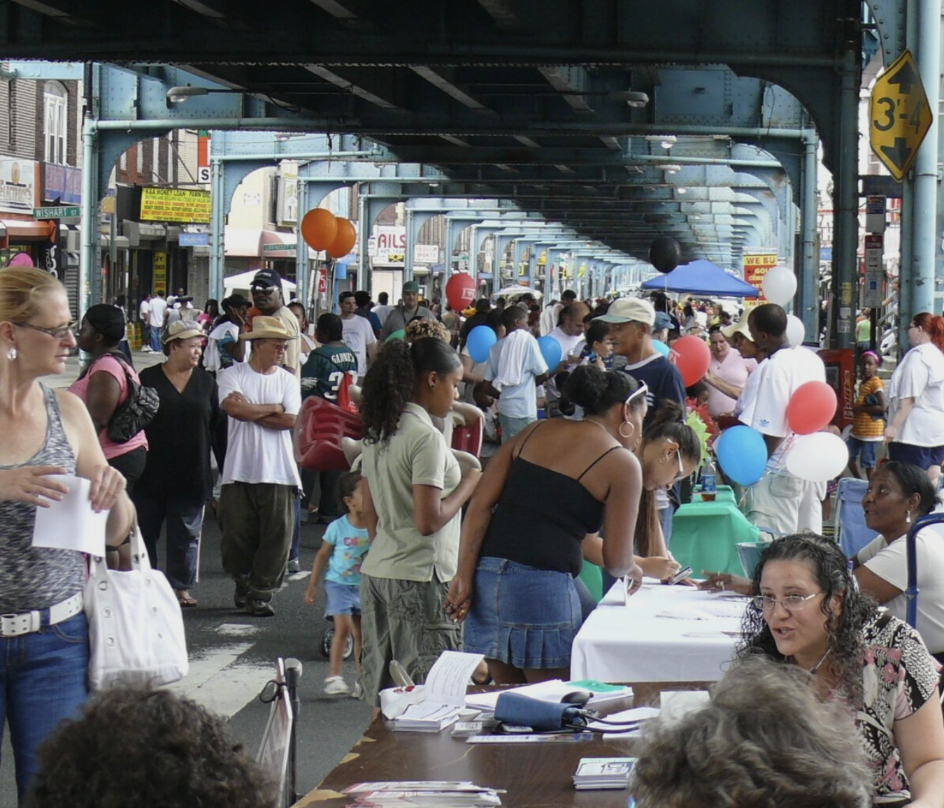 An early 2000s image of Frankford Avenue populated with residents during a community event