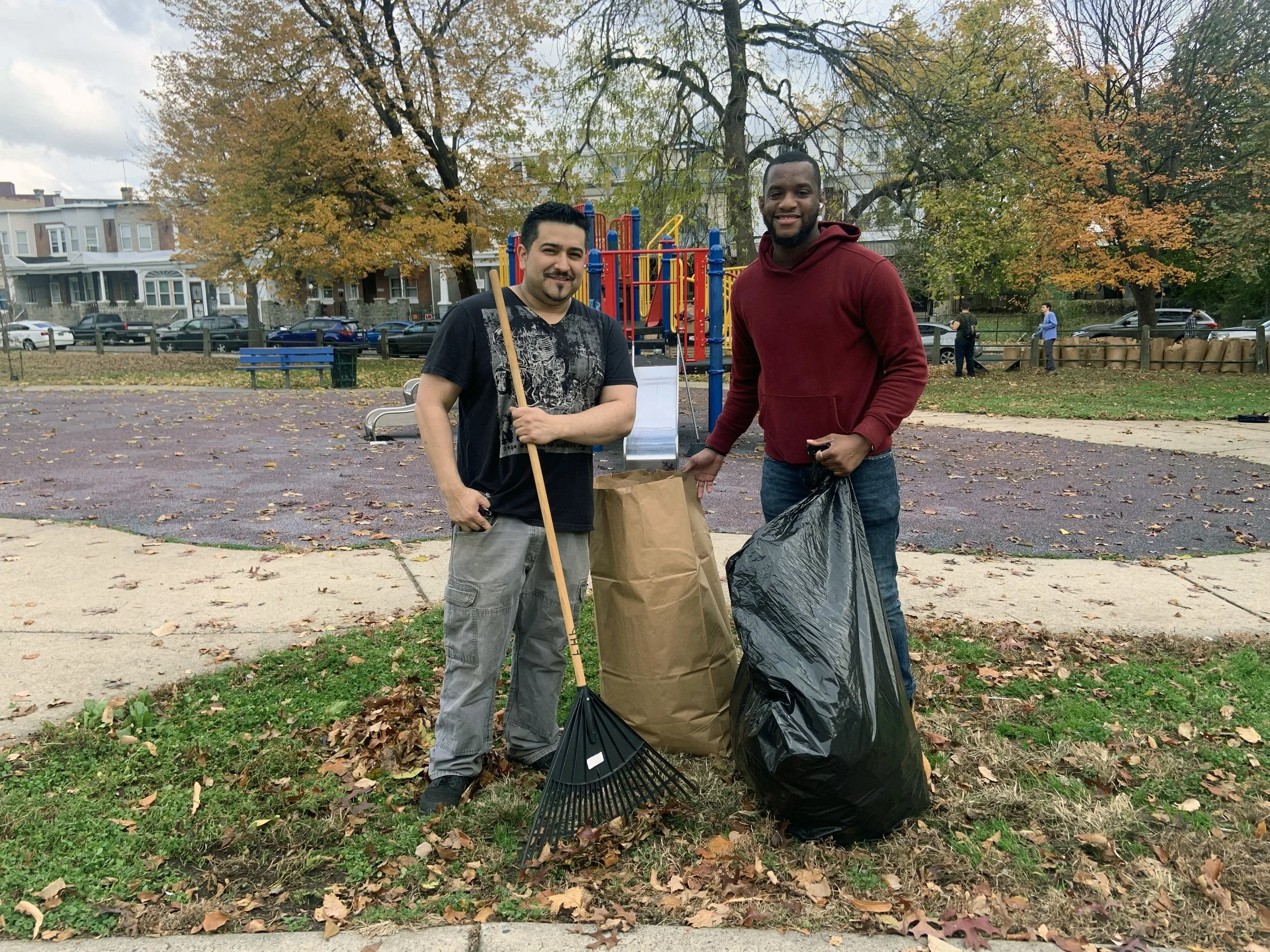 Two J-centrel residents volunteering at Harrowgate Park during the Good Neighbor program