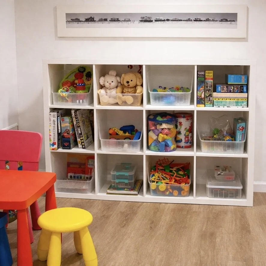 Organized children's playroom storage shelf, NYC home organizer