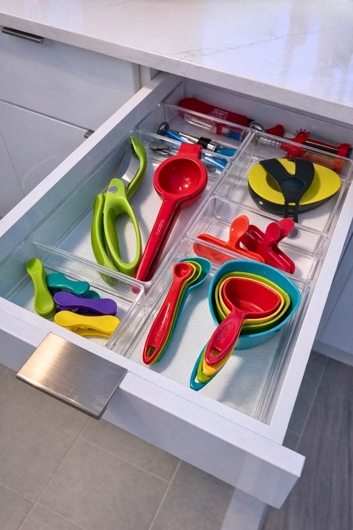 Organized kitchen drawer with utensils, NYC home organizer