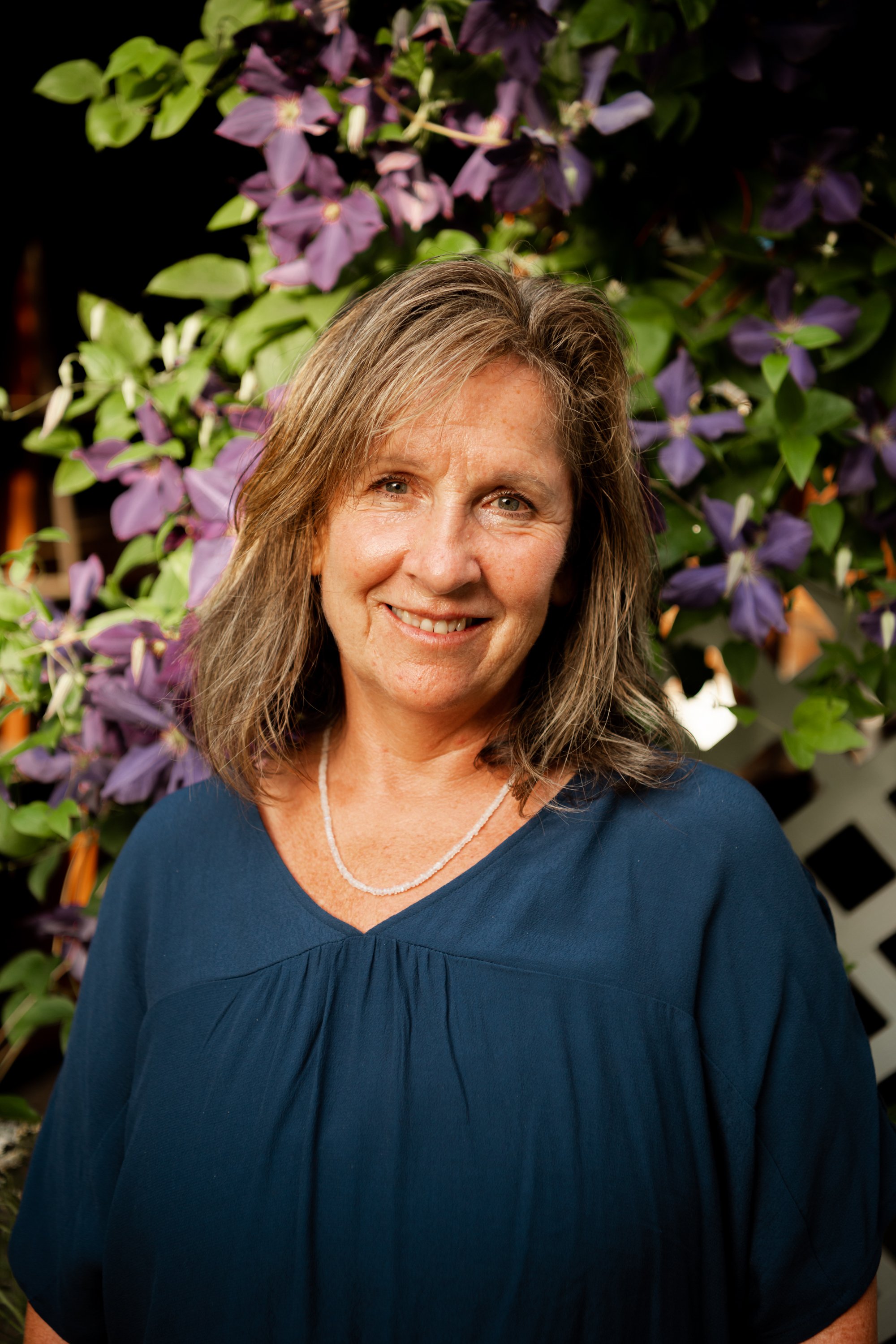Trish Zennie, massage therapist and holistic healing guide at Divinae, supporting body-centered care during retreat experiences.