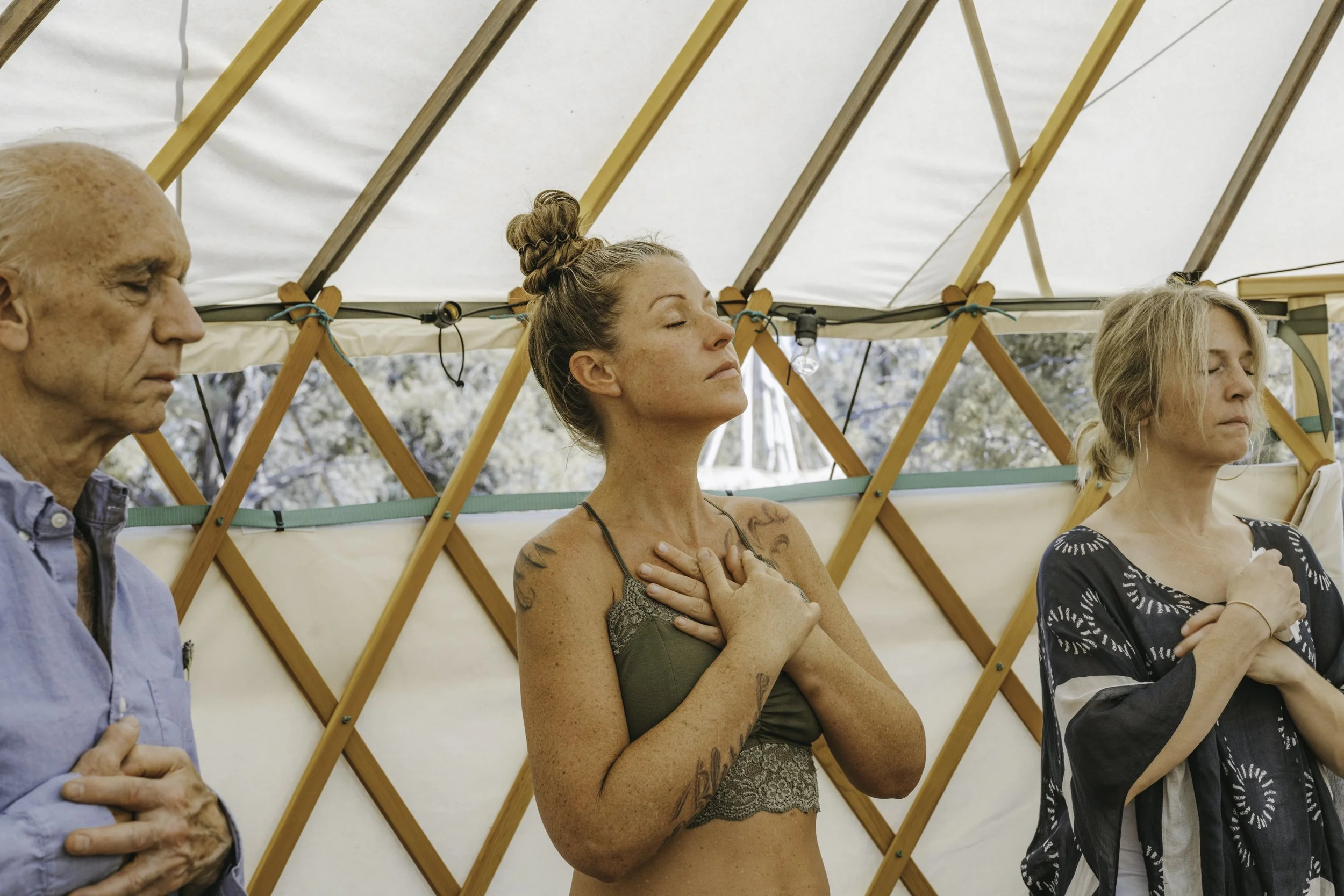 Participants gathered during a guided group psilocybin retreat ceremony in a peaceful, supportive setting.