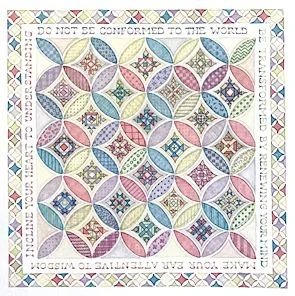 A colorful quilt with a geometric pattern of circles and diamonds, bordered by a decorative fringe.