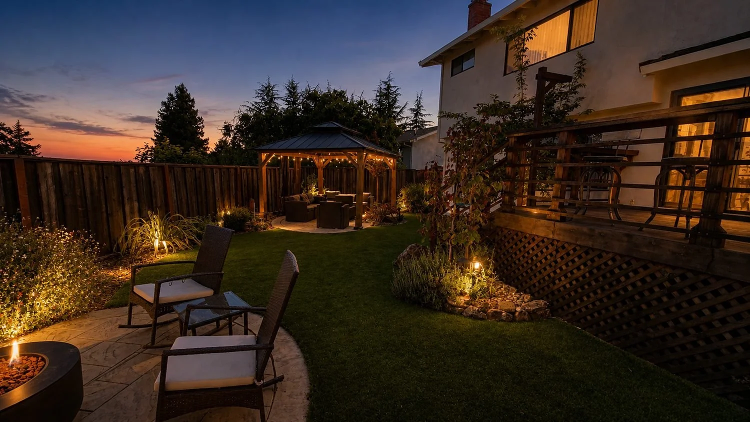 A cozy backyard during sunset with outdoor seating, a gazebo with string lights, a wooden deck, lush greenery, and decorative lighting.