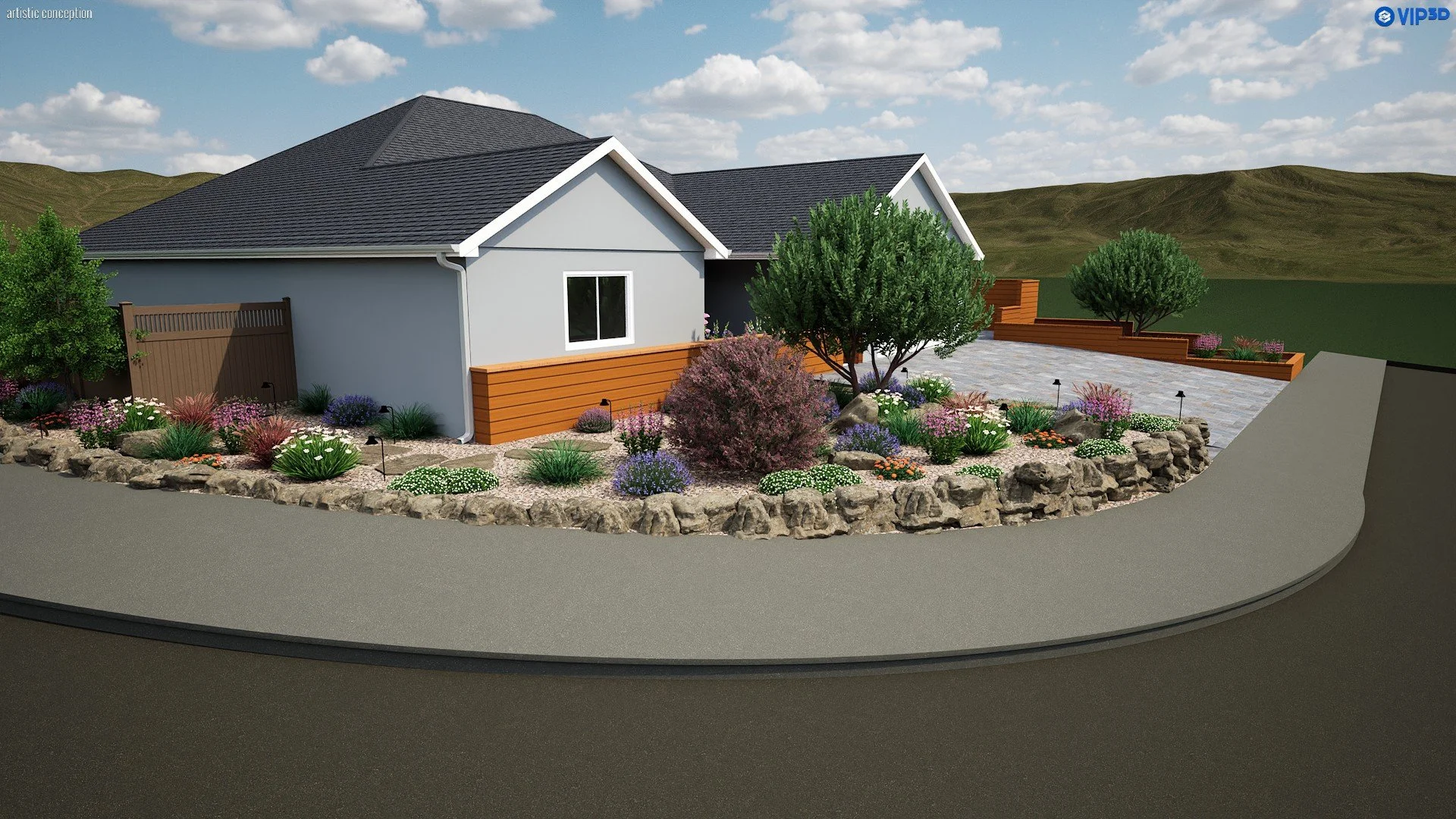 A landscaped backyard with a house, a garden bed with colorful flowers, bushes, and two trees, alongside a stone border and paved patio area, with rolling hills and a partly cloudy sky in the background.