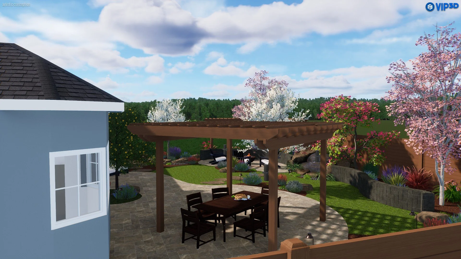 A backyard garden featuring a stone patio with a dining table and chairs beneath a wooden pergola, surrounded by lush green grass, blooming trees with pink, white, and purple flowers, and various colorful plants and shrubs. A blue house with white tr
