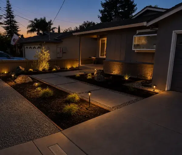Front yard landscape design with illuminated walkway and path lighting in Dublin, CA