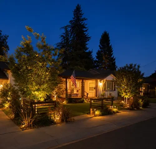 Front yard landscape transformation with garden lighting at dusk in Castro Valley, CA