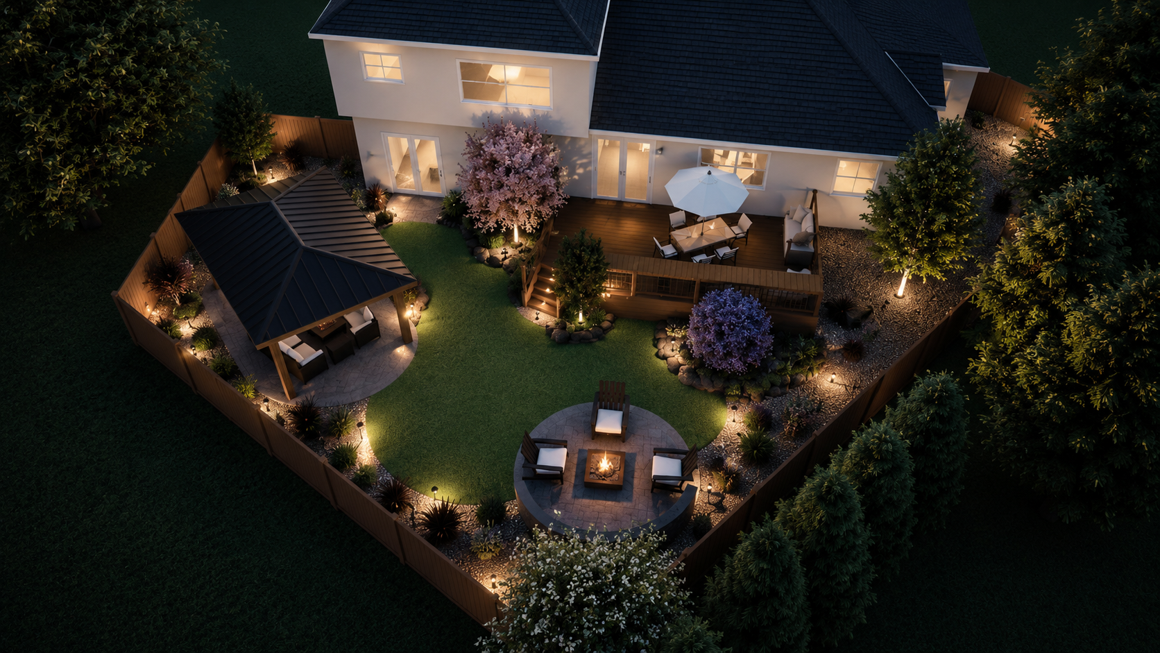 Aerial view of a backyard at night with a house, a gazebo, a deck with outdoor furniture, a fire pit with chairs, and surrounding trees and landscaping.