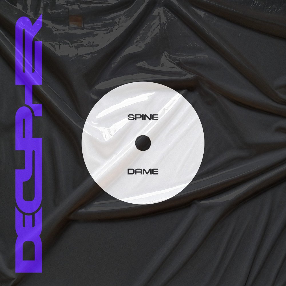 Black vinyl record cover with a white label in the center that has the words 'SPINE' and 'DAME' printed on it. The word 'DUSUDE' is written vertically in bold purple letters along the left side of the cover.