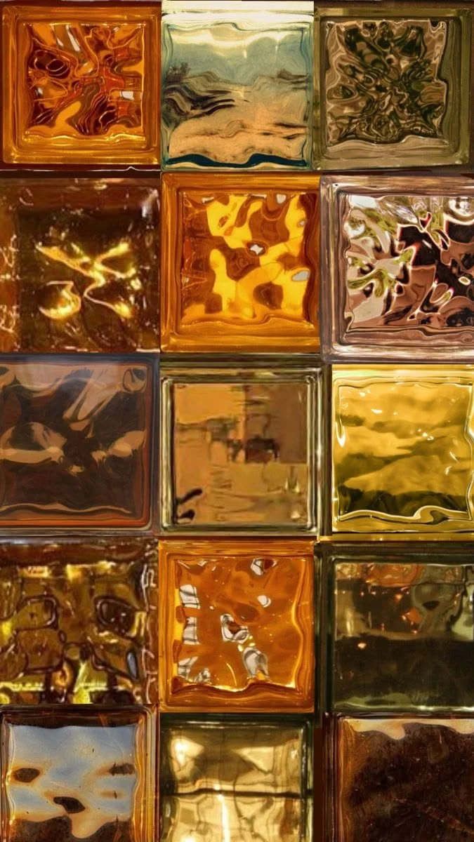 Close-up of colorful, reflective glass tiles arranged in a grid pattern.