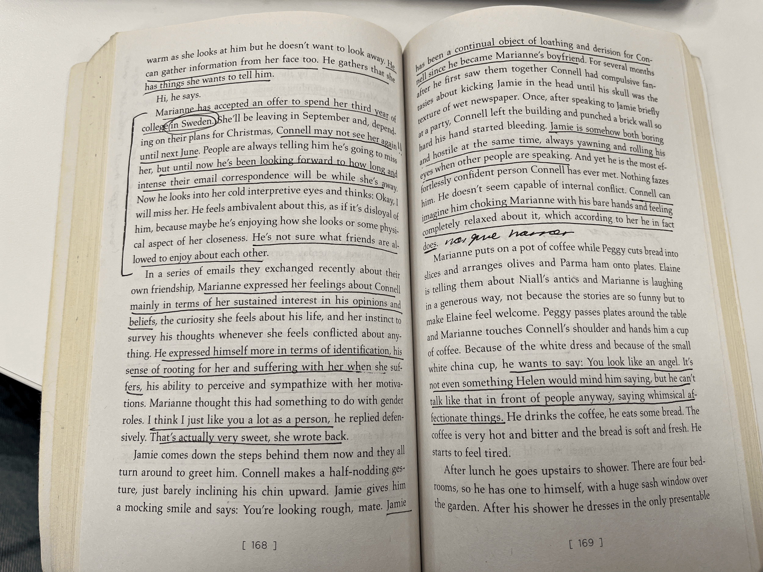An open paperback book showing pages 168 and 169 with handwritten annotations and underlined text. The visible text discusses a character named Connell and his thoughts and feelings, with mention of Sweden and a college.