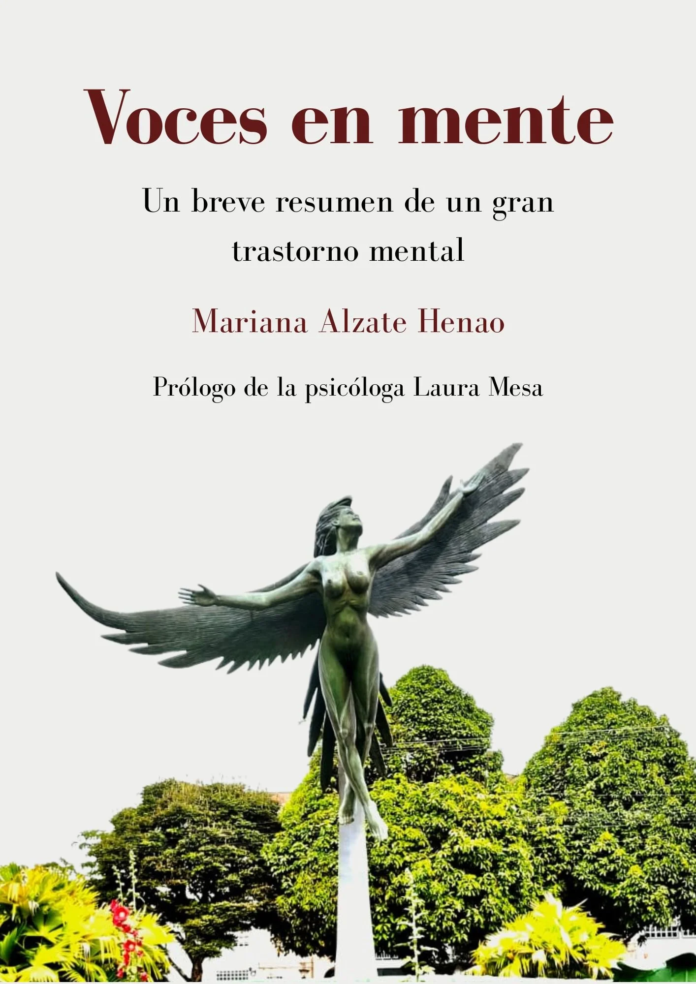 Statue of a woman with outstretched arms and large wings, surrounded by lush greenery and trees under a clear sky.
