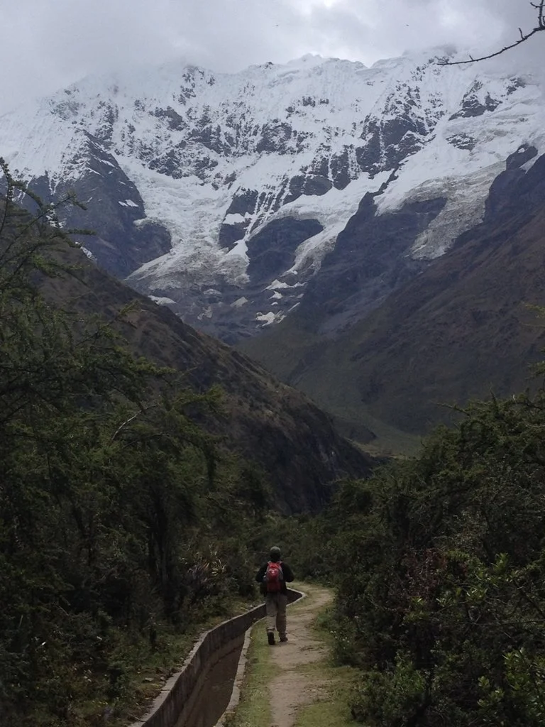 Shinichi Daimyo, psych NP and therapist for Greater Boston via telehealth, walks down mountain path.