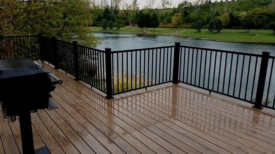 Deck Masters' custom wooden deck after a fresh rain. It’s Time to Bring Your Outdoor Living Space to Life with Deck Masters!