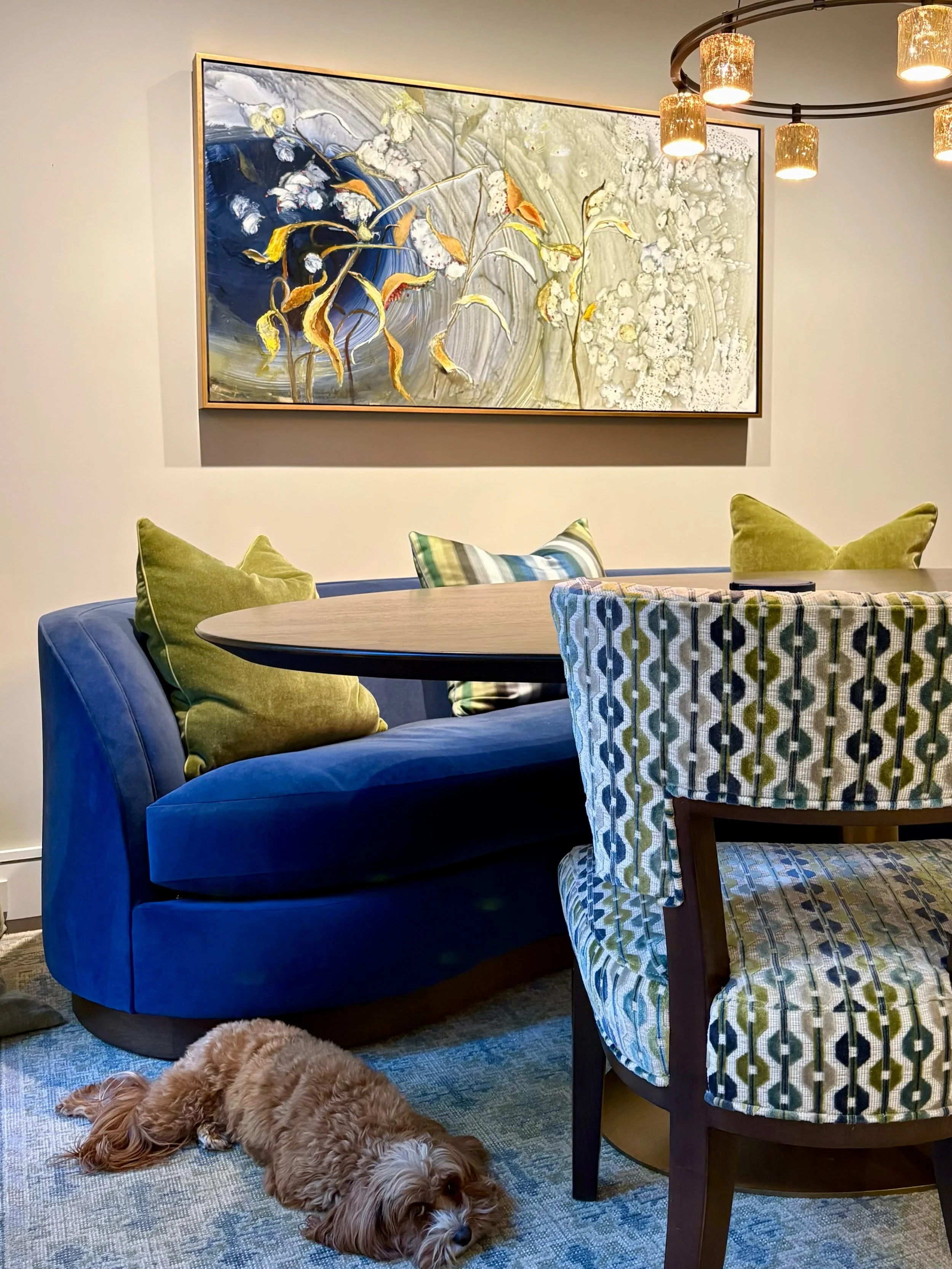 In this South End brownstone, the clients wanted to bring the beauty of nature from their courtyard into their dining room. Ilana Manolson&rsquo;s painting Milkweed does just that! Framed in gold by The Frame Center, the piece beautifully complements