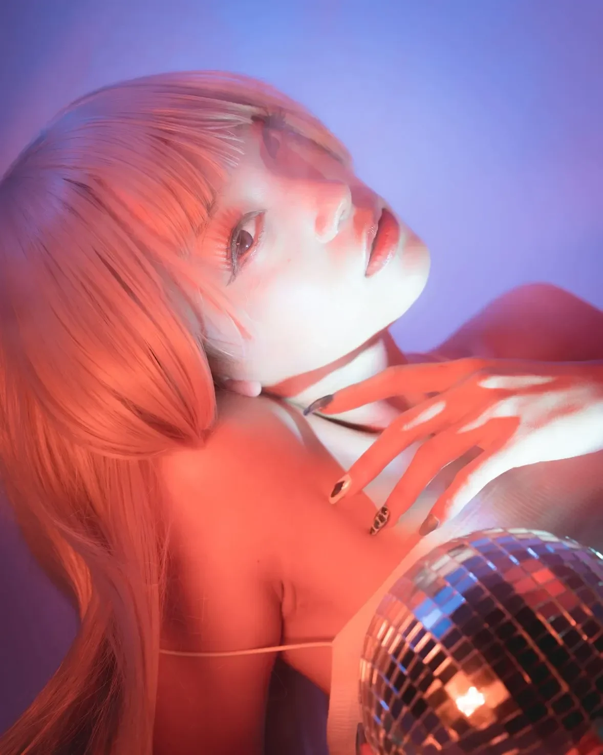 Bathed in neon light, lost in the shimmer of reflections.