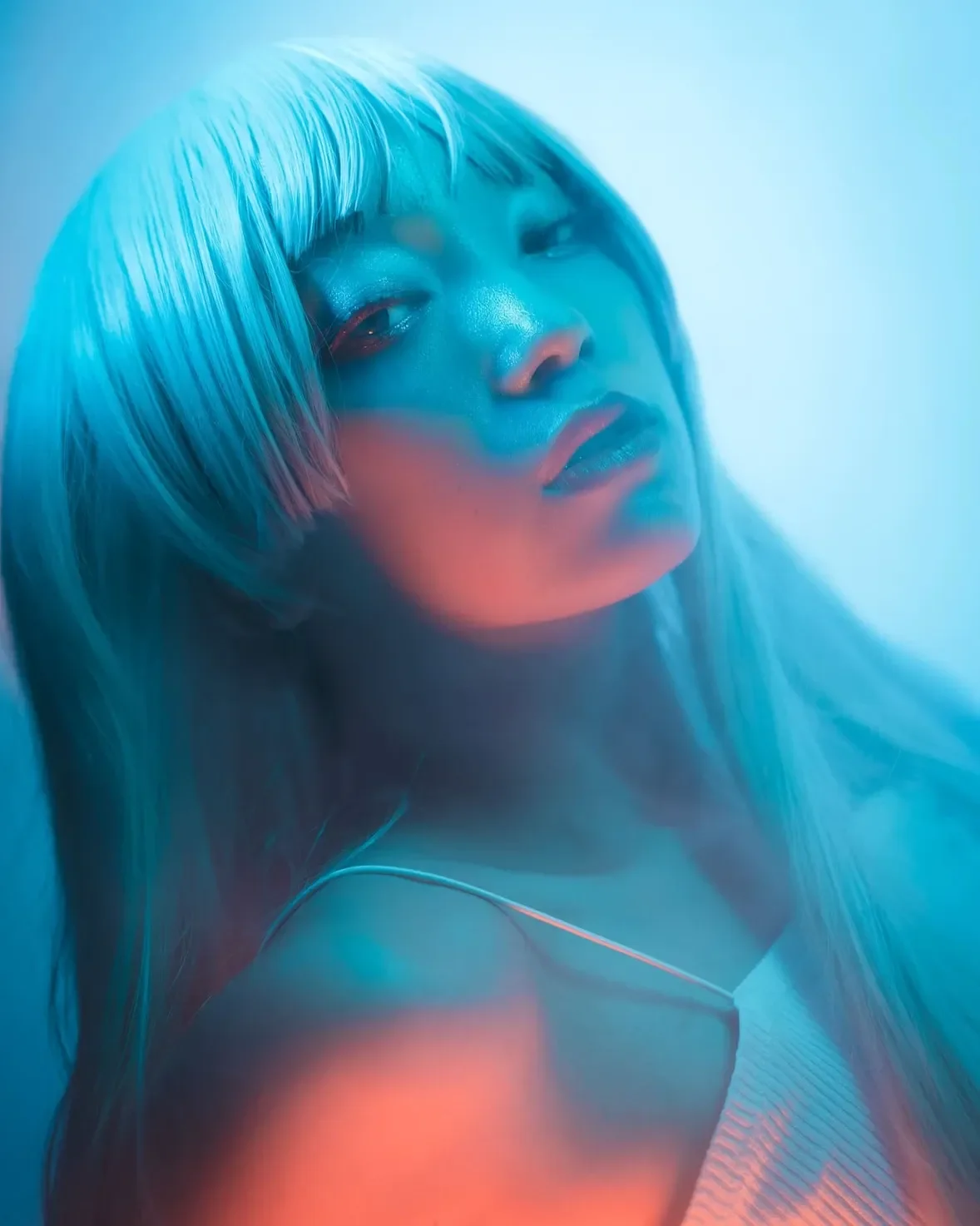 A gaze that speaks in neon and shadow.