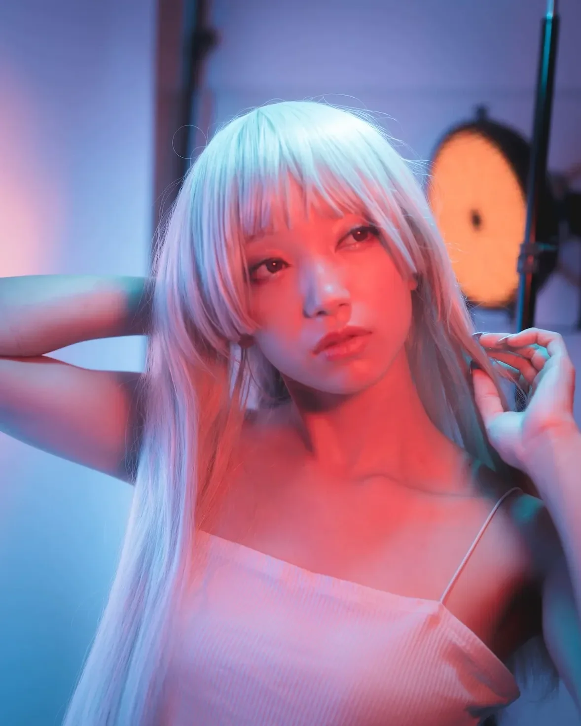 Caught between light and shadow, lost in a neon dream.