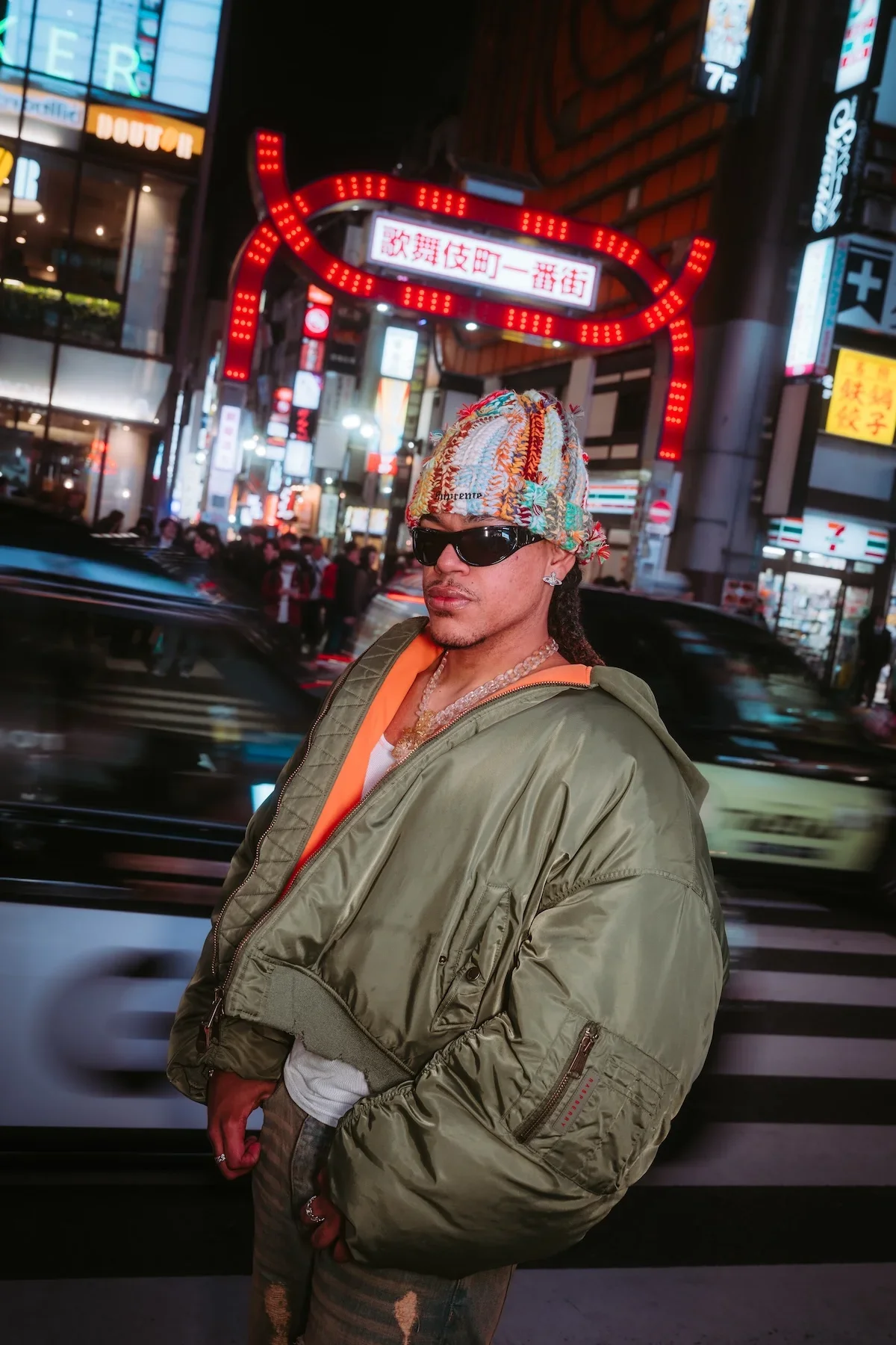  Cinematic street scene showcasing vibrant red light district nightlife displays in Shinjuku at night. 