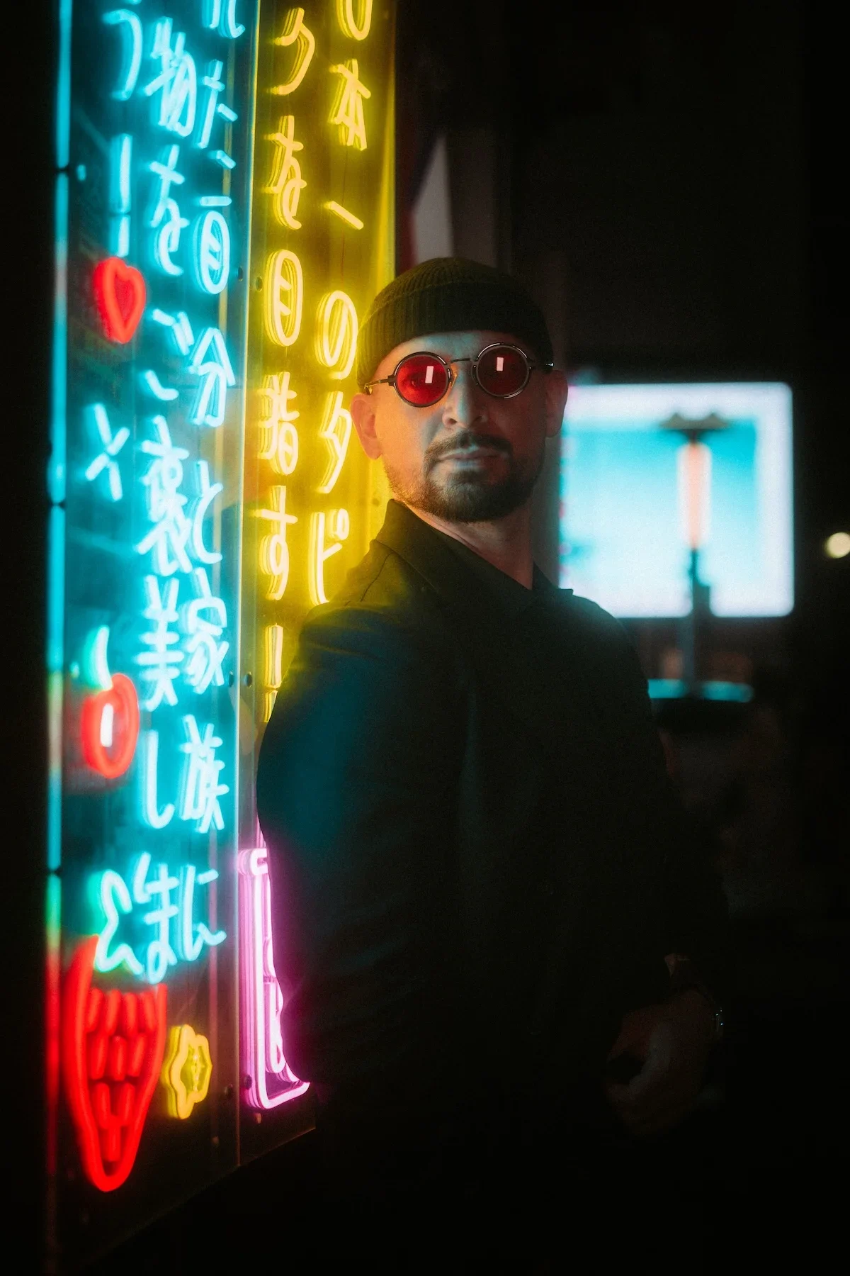  High-energy lifestyle photography featuring a street portrait with the iconic Shibuya 109 building in the background. 
