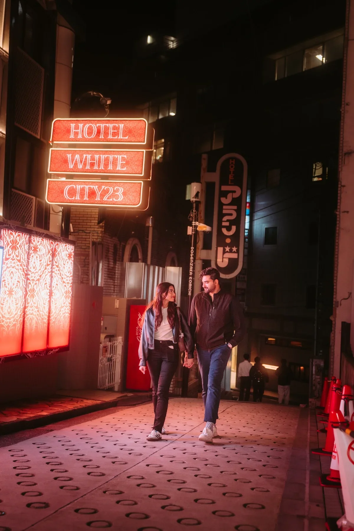  Futuristic cyberpunk street portrait of a couple navigating a dense pedestrian street corner in Shibuya evening. 