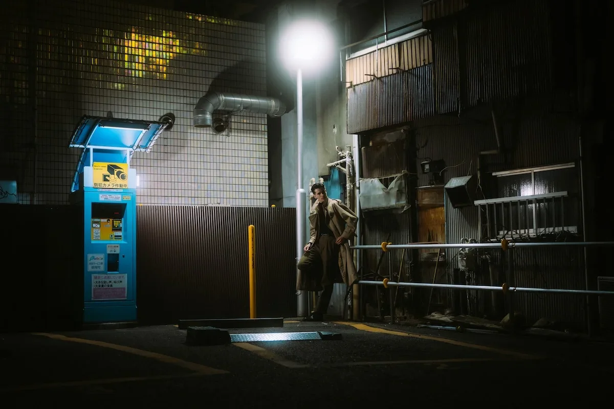  Candid couples photography featuring low-hanging vintage signs and tight textured wooden pathways in retro Tokyo. 