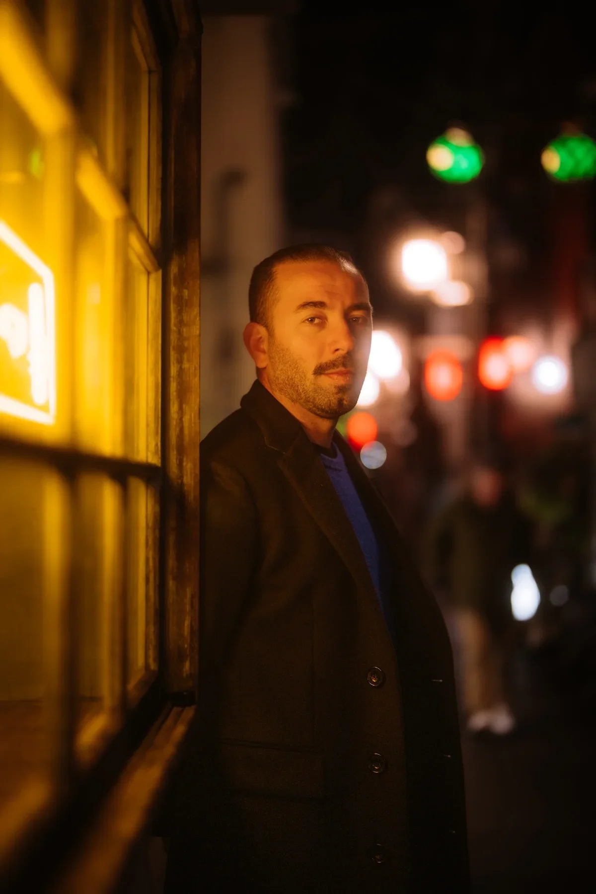  Lifestyle portrait highlighting a traveler exploring the iconic subculture walkways of Nakano Broadway shopping mall. 