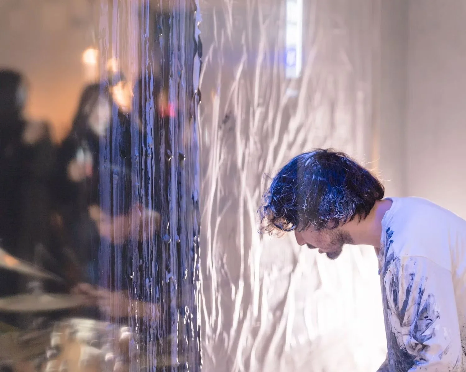 Artist Working Behind Transparent Plastic in Live Art Performance