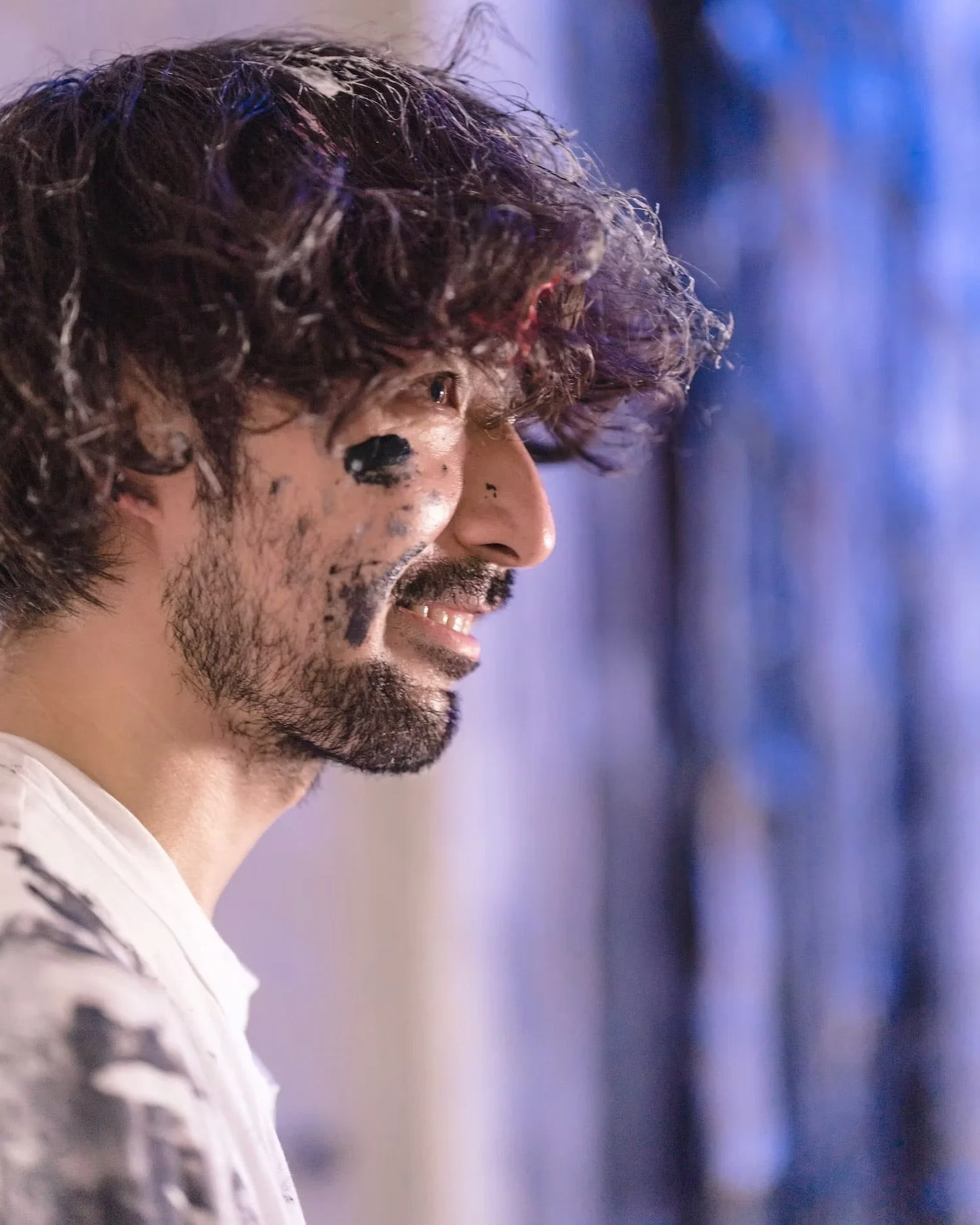 Artist Smiling After Completing His Art