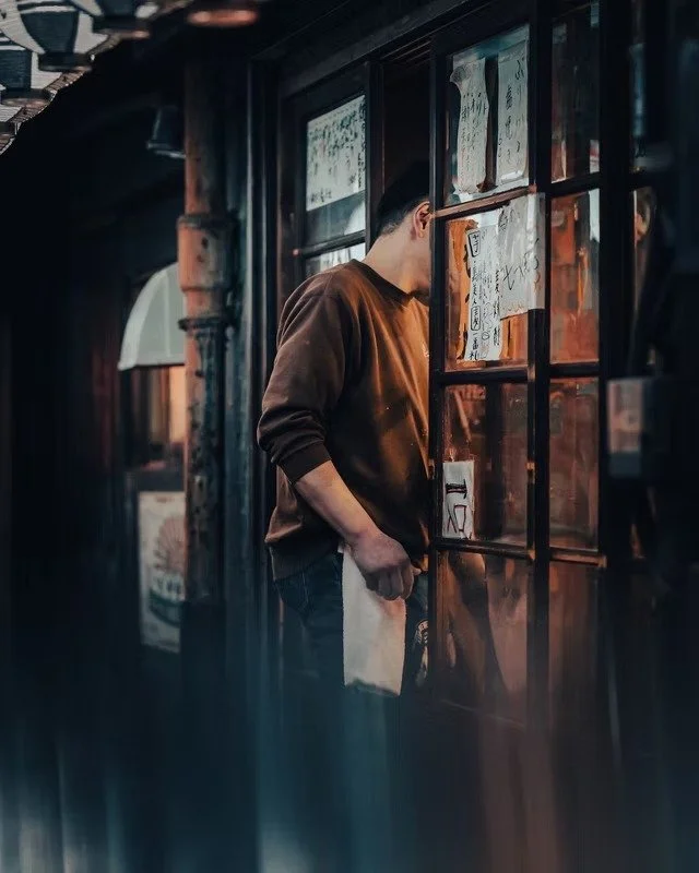Man Peering into a Tokyo Restaurant