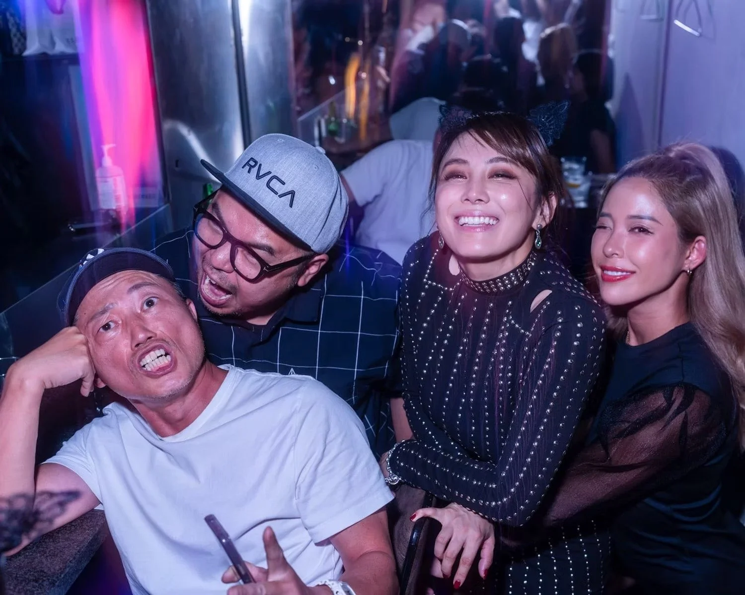 Friends having a great time at a lively event in Shibuya.