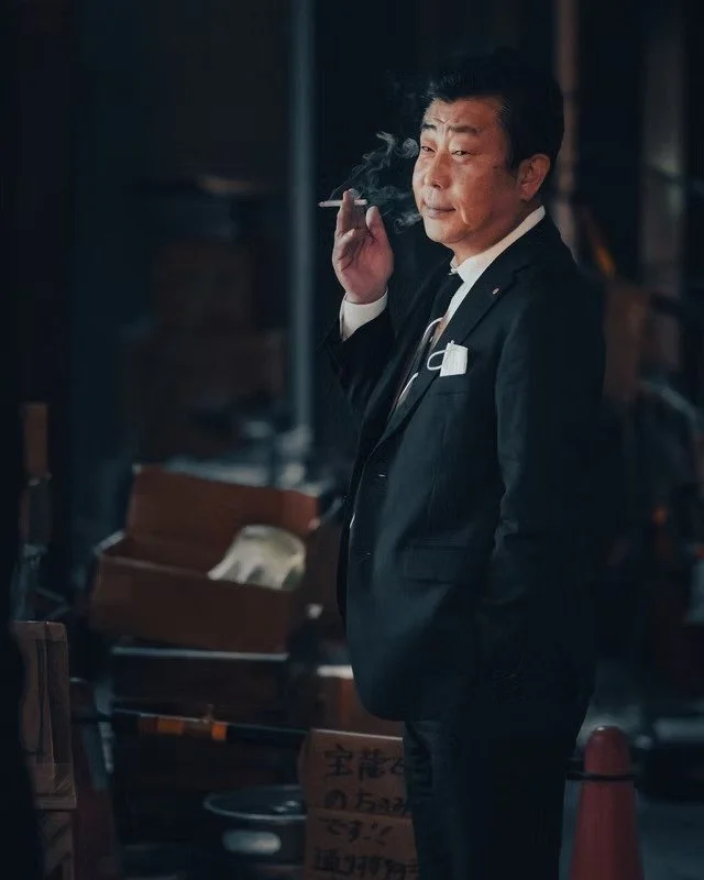 Man Smoking Outside in Tokyo