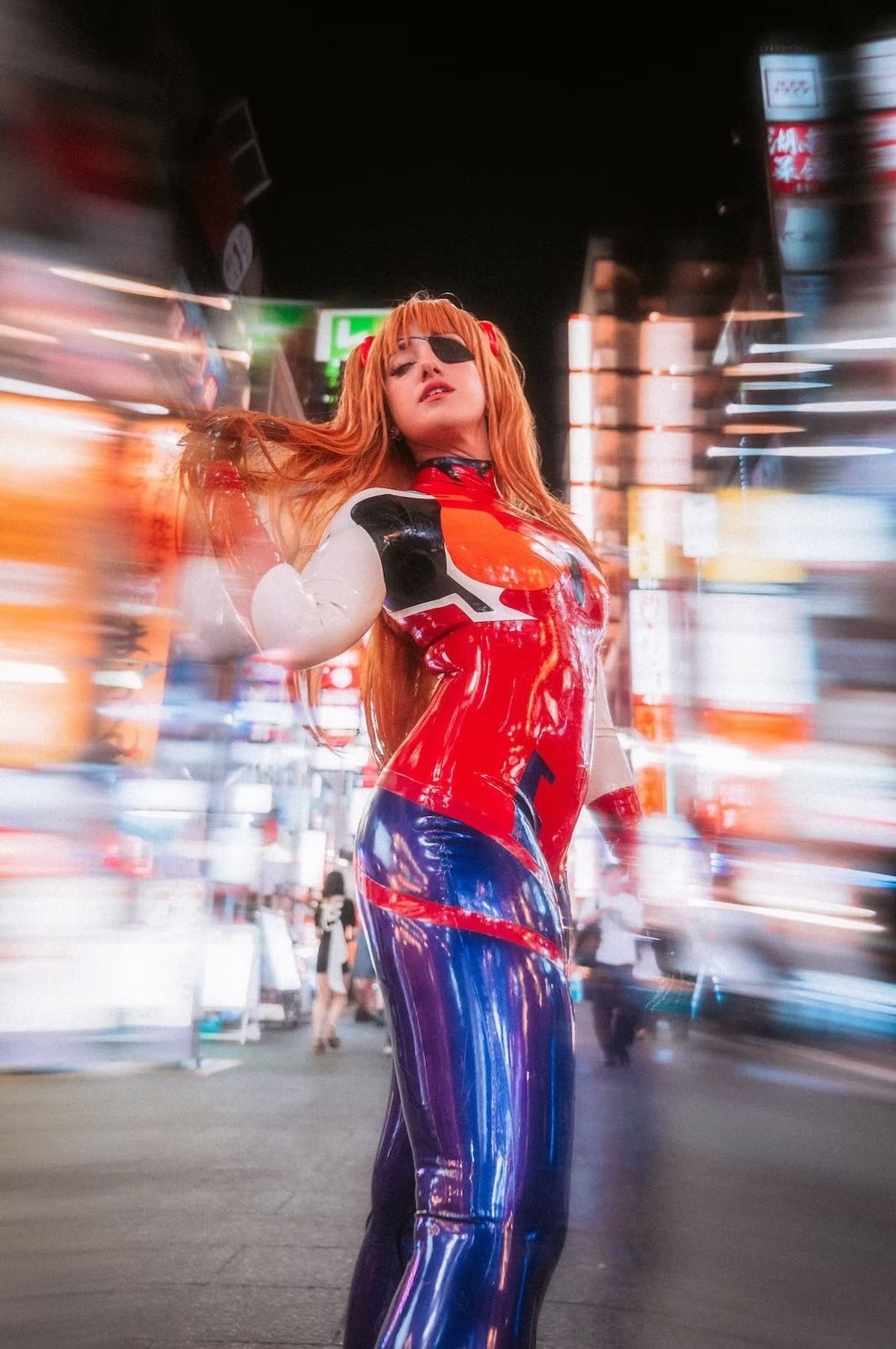 A woman dressed in a Evangelion Cosplay costume strikes a dynamic pose in a bustling city at night. The neon lights and motion blur bring life to the scene, creating a vibrant and energetic atmosphere.