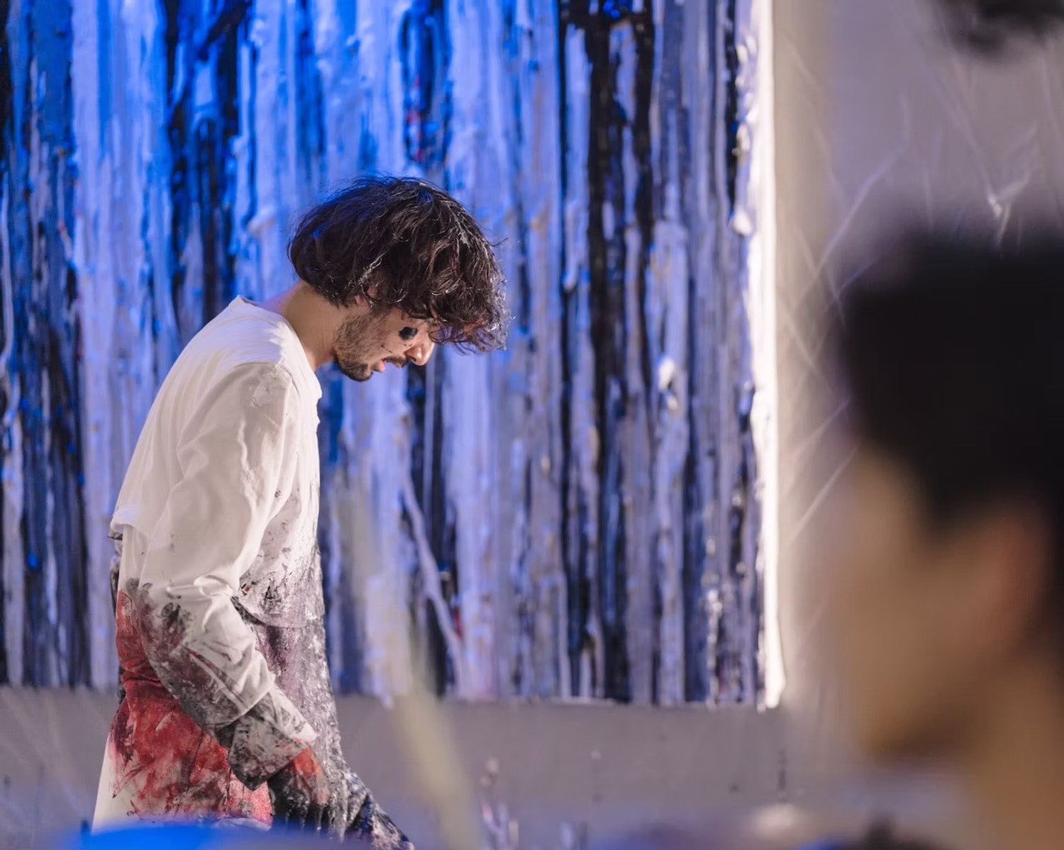 Artist Contemplating His Abstract Artwork