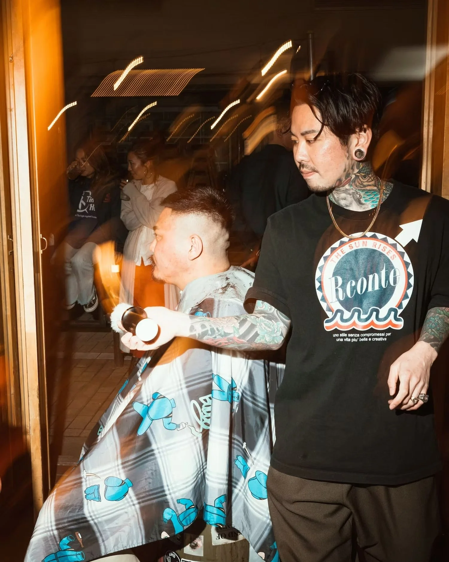 Barber cutting hair at a lively event Shibuya.