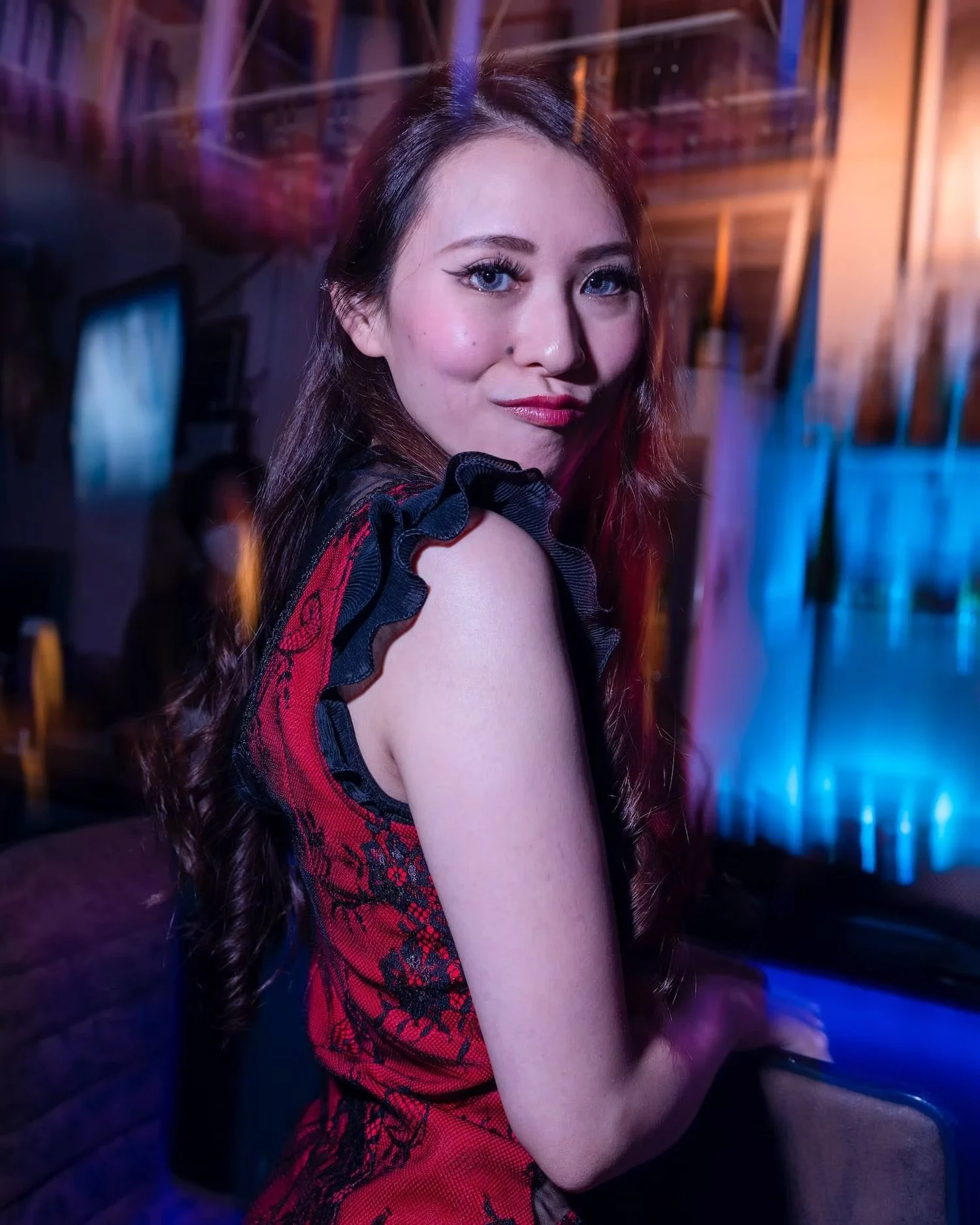 Portrait of a Woman in Red Dress at a Night Out