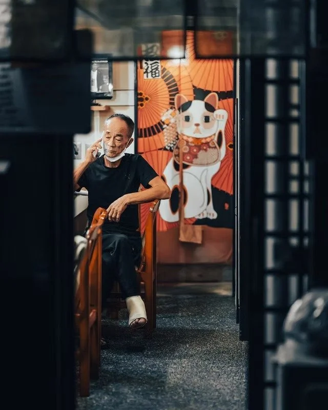Manan Front of a Cat-Themed Tokyo Restaurant