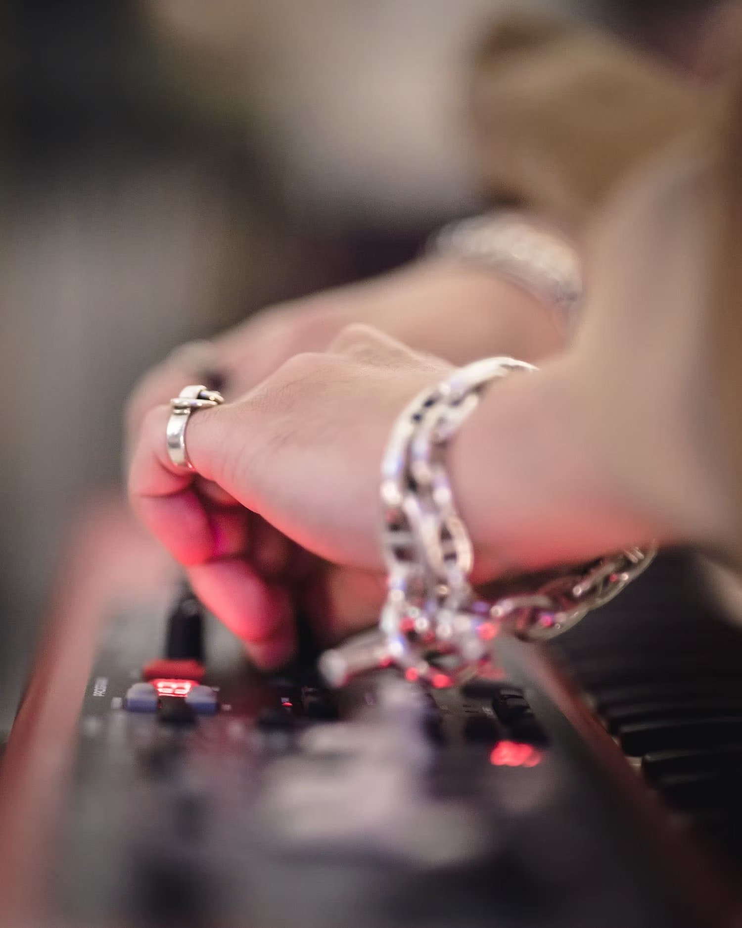 Close-up of Hands Adjusting Keyboard During Live Performance