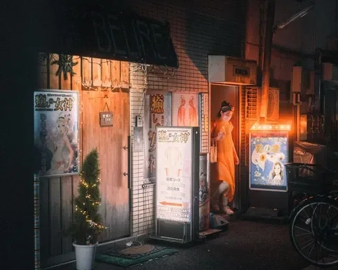 A cozy shop illuminated by neon signs, with a person walking into it.