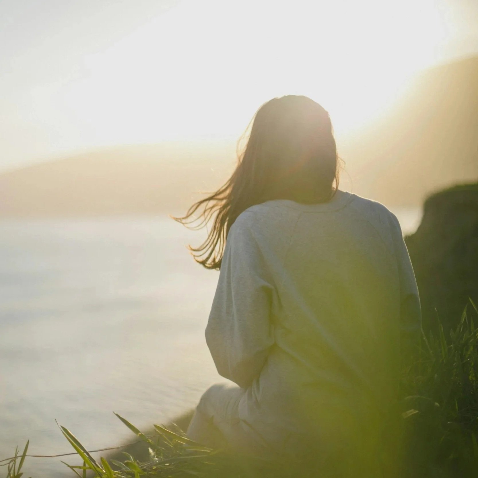 Woman looking out to the ocean.
