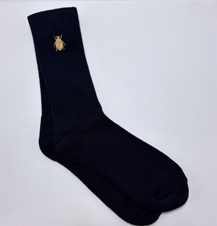 All black with gold scarabs.png